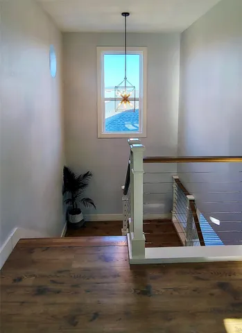 a view of entryway with wooden floor