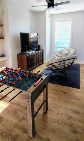 a room with furniture and flat screen tv