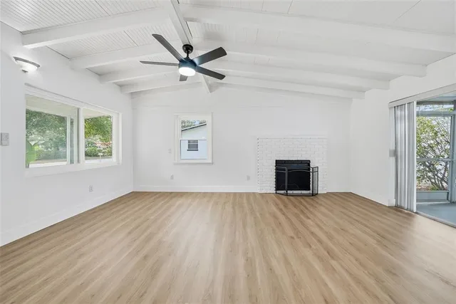 a kitchen with stainless steel appliances granite countertop a refrigerator and a stove