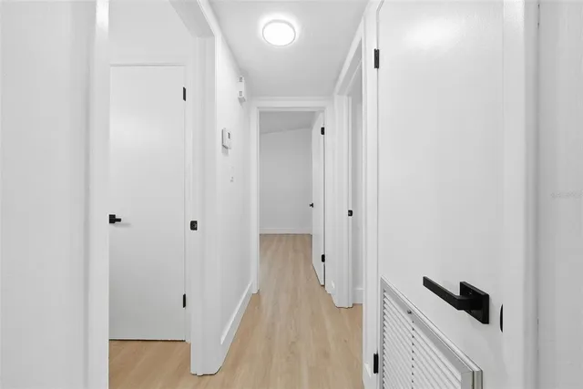 a view of a bathroom with a shower and a sink