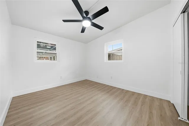 a view of a livingroom with an empty space and a window