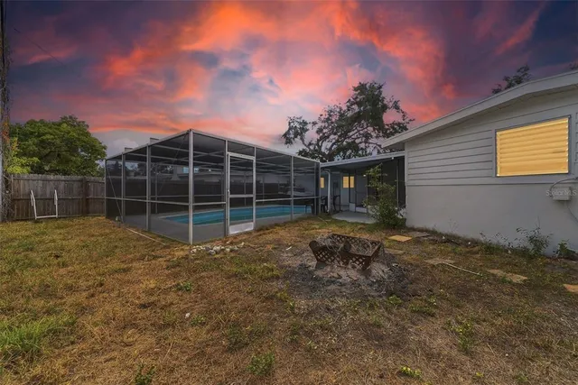 a view of a backyard with sitting area