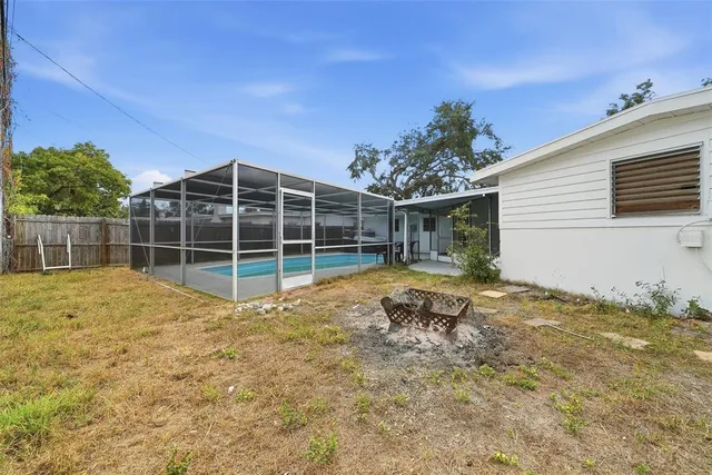 a view of washer and dryer with chandelier in front of it