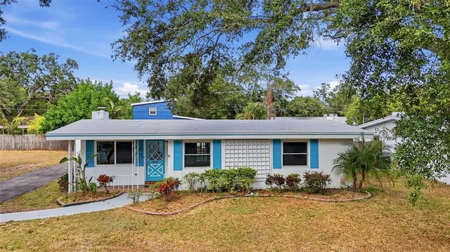 a front view of house with yard and seating space