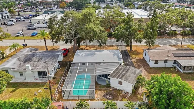 an aerial view of residential houses with outdoor space