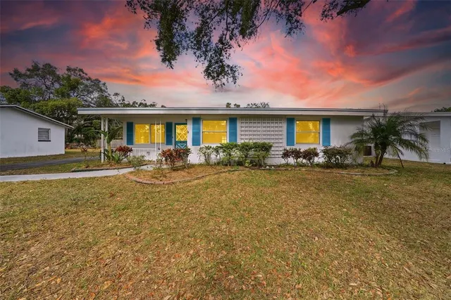 front view of a house with a yard