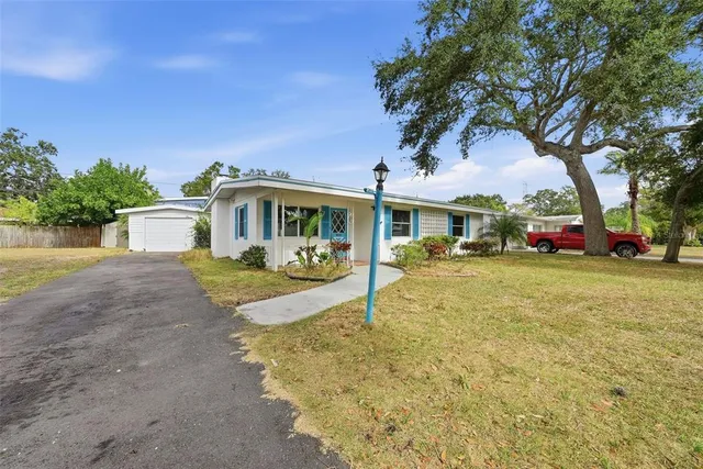 a backyard of a house with lots of green space
