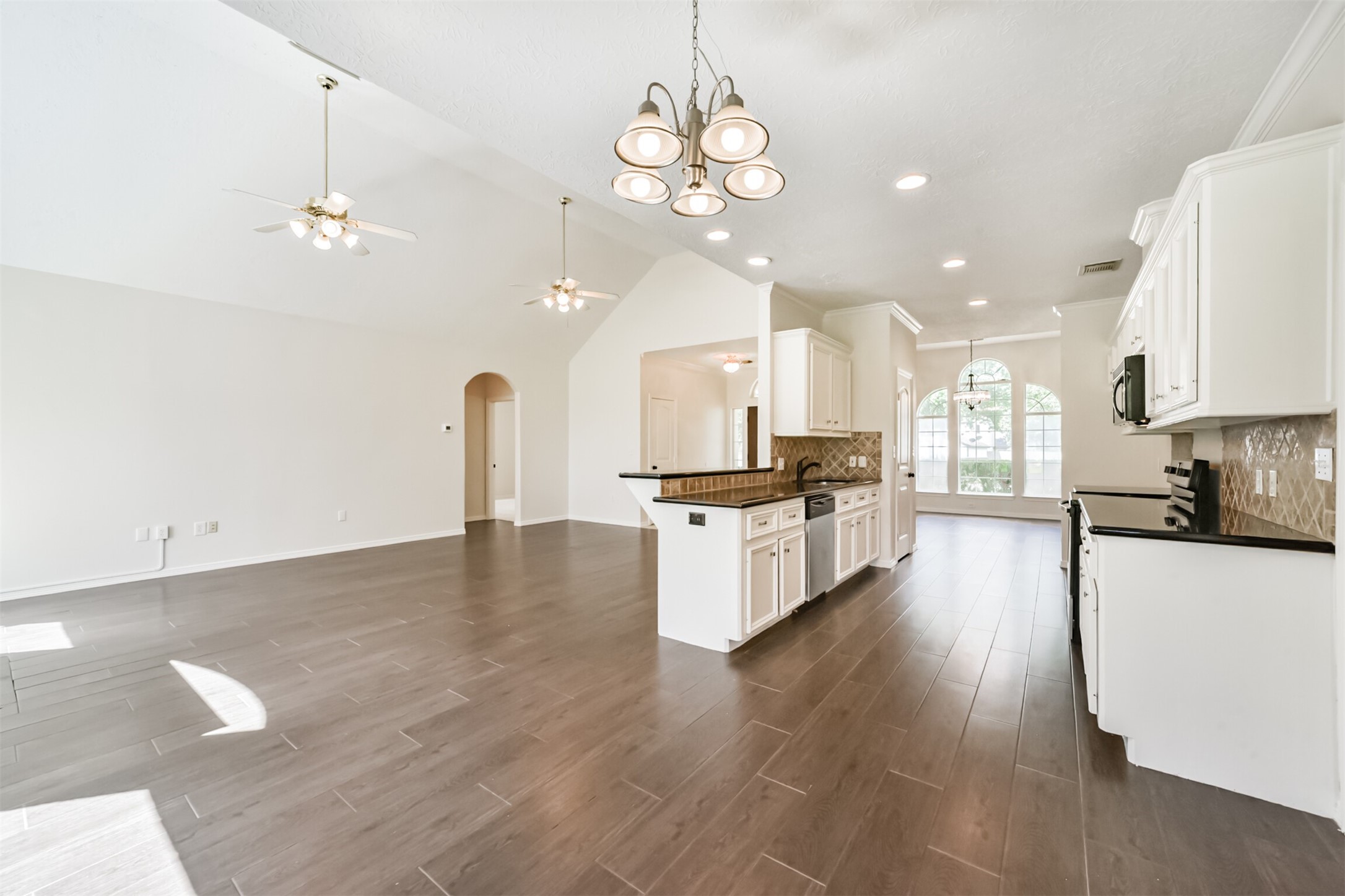 27322 Afton Way Huffman, TX 77336 - Photo 50 of 50 Open-concept floor plan blends the kitchen, dining, and living areas seamlessly for effortless entertaining and comfortable everyday living.