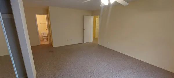 an empty room with a hallway