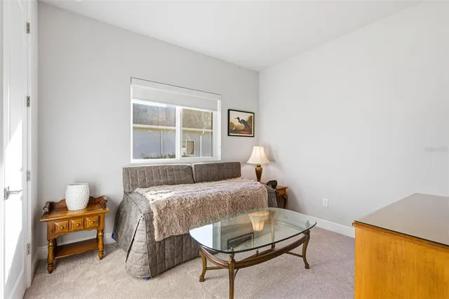 a bathroom with a granite countertop sink toilet a mirror a bathtub and shower