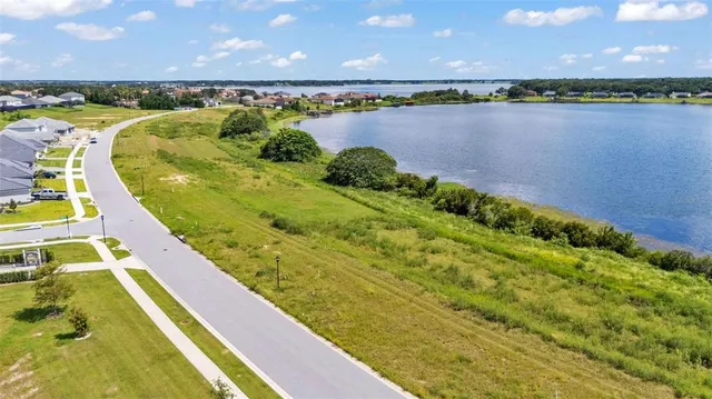 a view of a swimming pool and an outdoor seating