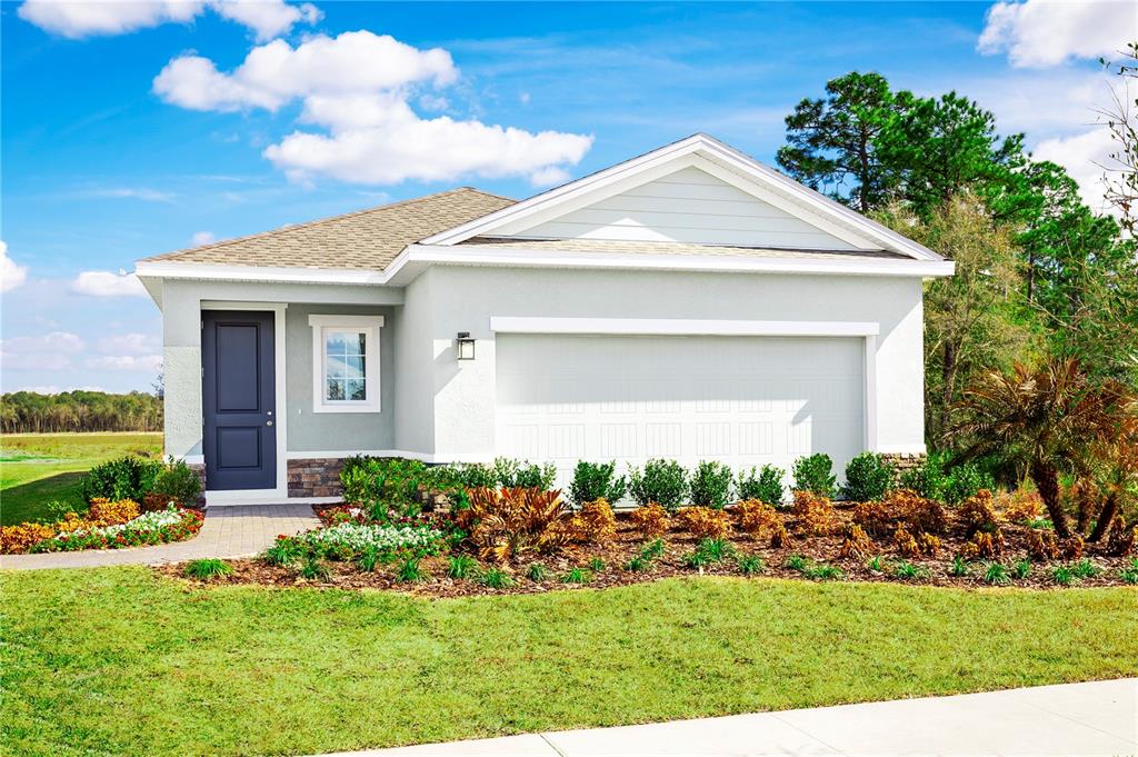 11844 Bristol Bridge Rd Spring Hill Spring Hill, FL 34610 - Photo 1 of 1 a front view of a house with a yard