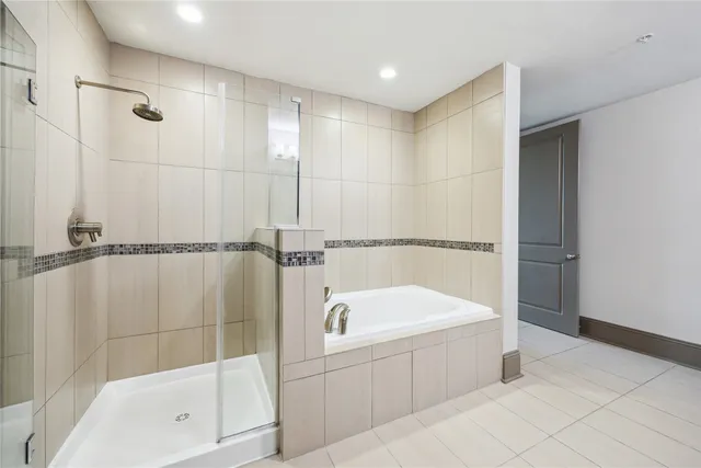 a bathroom with a bathtub and a shower