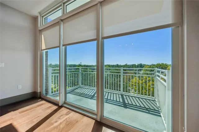 a view of balcony with floor to ceiling window