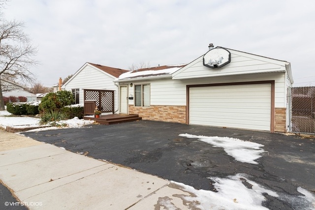 10759 Oak Avenue Chicago Ridge, IL 60415 - Photo 17 of 19 a front view of a house with a yard and garage