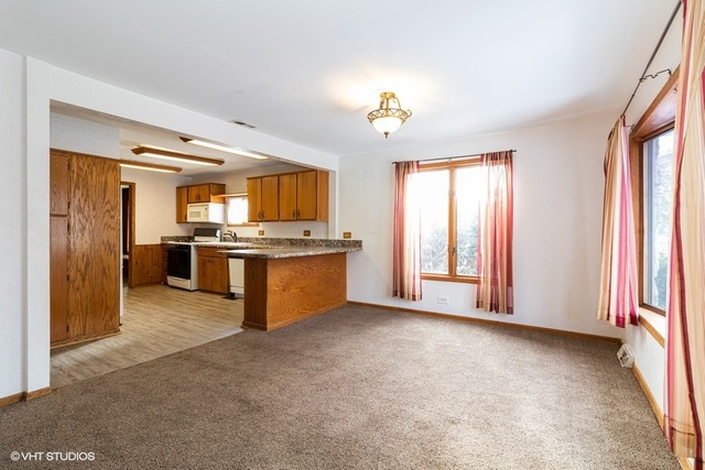 10759 Oak Avenue Chicago Ridge, IL 60415 - Photo 4 of 19 a view of kitchen with stainless steel appliances kitchen island granite countertop a stove and a sink