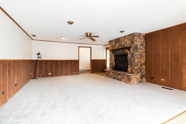 10759 Oak Avenue Chicago Ridge, IL 60415 - Photo 7 of 19 a view of a livingroom with furniture and a fireplace