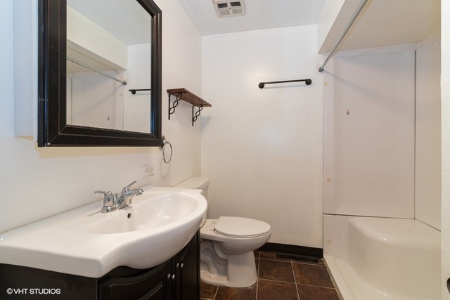 10759 Oak Avenue Chicago Ridge, IL 60415 - Photo 8 of 19 a bathroom with a sink toilet and a mirror