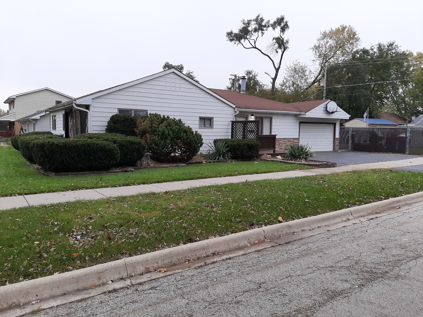 10759 Oak Avenue Chicago Ridge, IL 60415 - Photo 10 of 19 a front view of a house with a yard and garage
