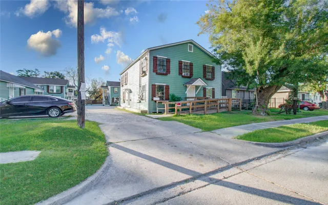 a front view of a house with a yard and table and chairs