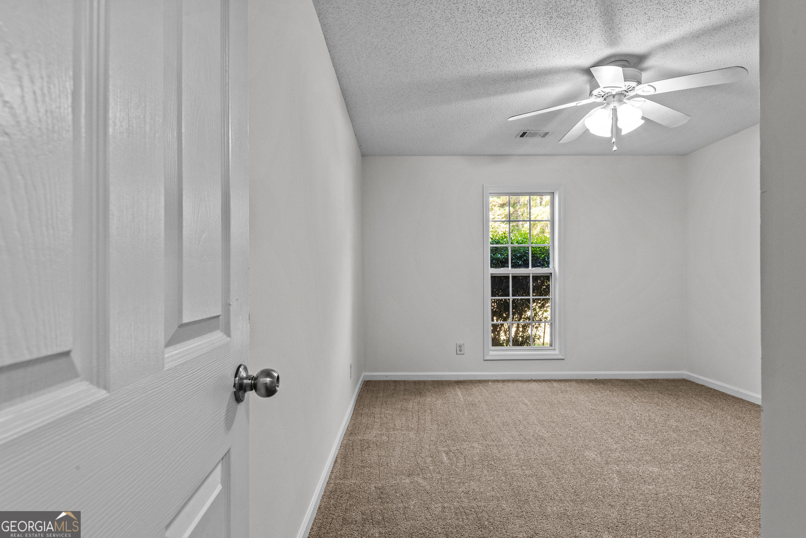 427 Bridges Way Winterville, GA 30683 - Photo 21 of 43 a view of an empty room with a window