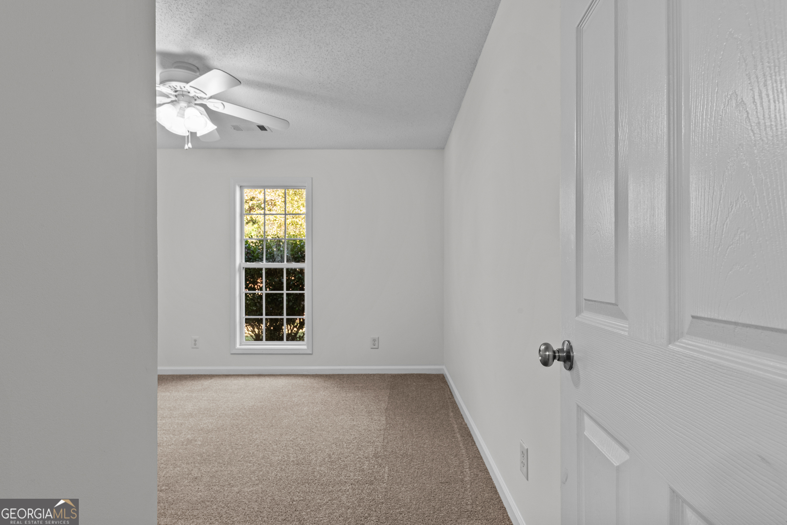 427 Bridges Way Winterville, GA 30683 - Photo 23 of 43 a view of an empty room with a window