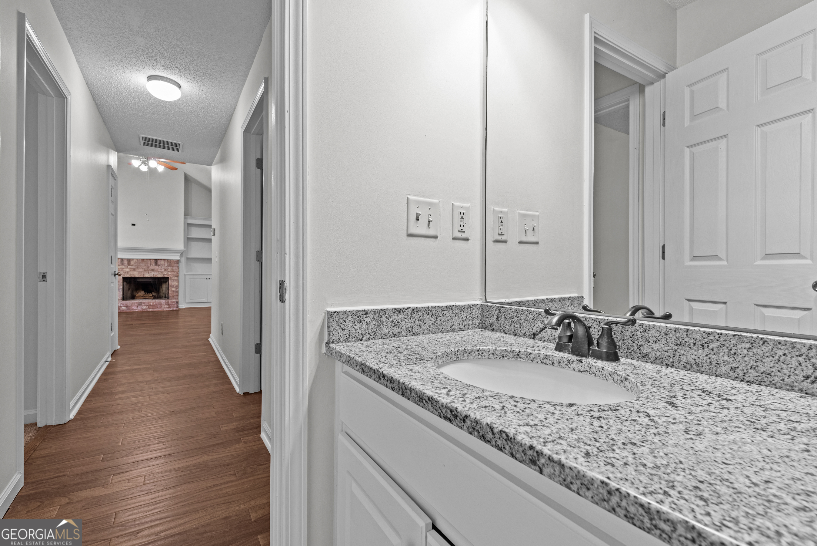 427 Bridges Way Winterville, GA 30683 - Photo 26 of 43 a bathroom with a granite countertop sink and a mirror
