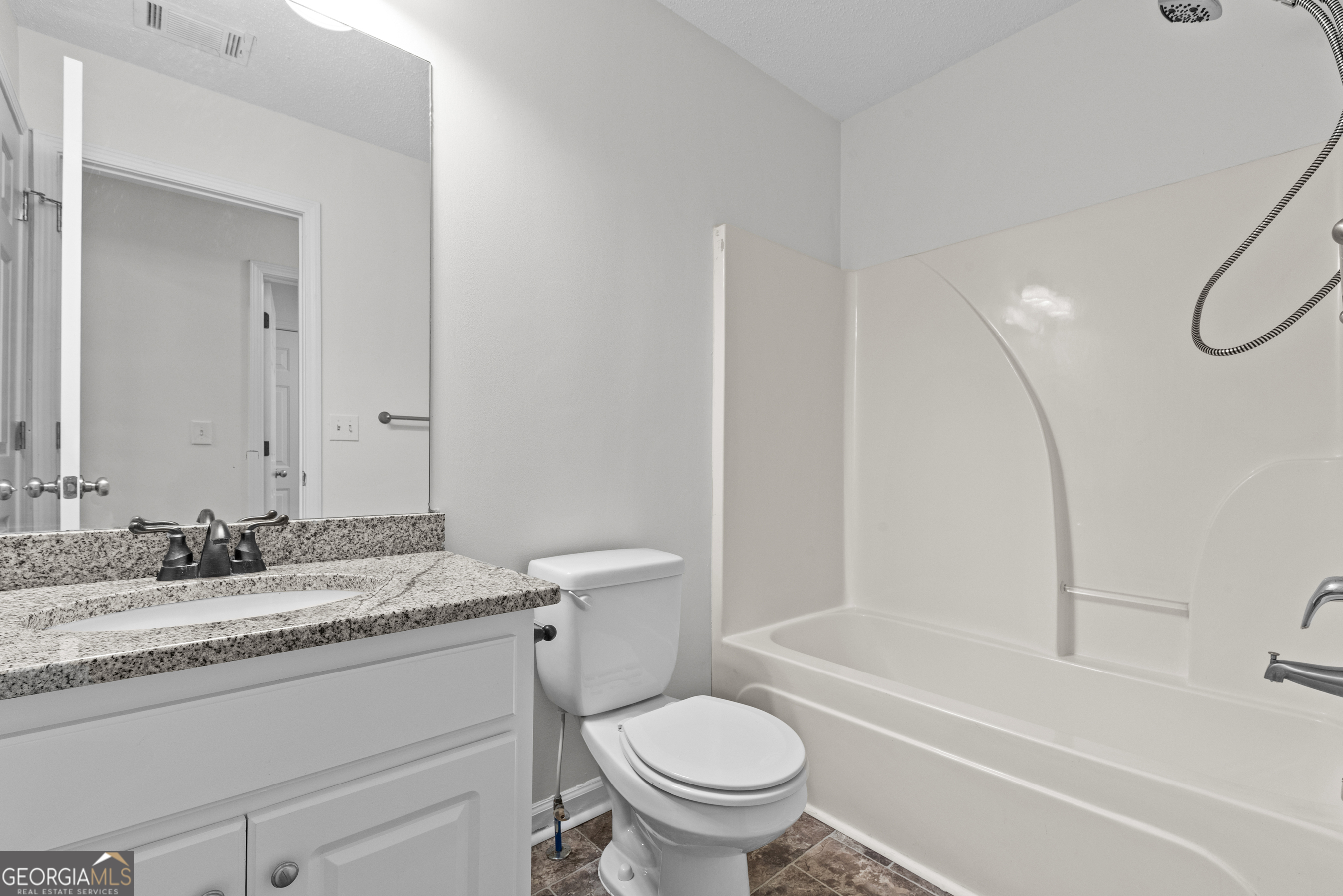 427 Bridges Way Winterville, GA 30683 - Photo 35 of 43 a bathroom with a granite countertop sink toilet and shower