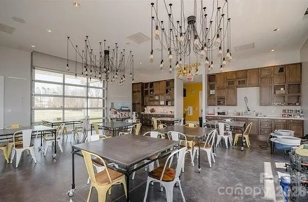 a view of a dining area with furniture and chandelier