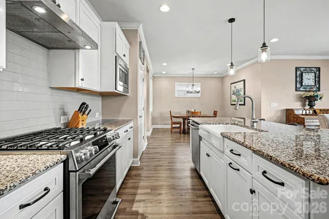 a kitchen with granite countertop lots of counter top space