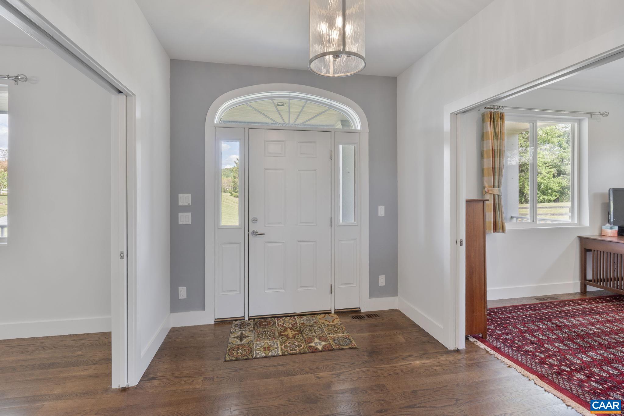 3457 Morgantown Road Charlottesville, VA 22903 - Photo 16 of 64 a view of an entryway with a chandelier