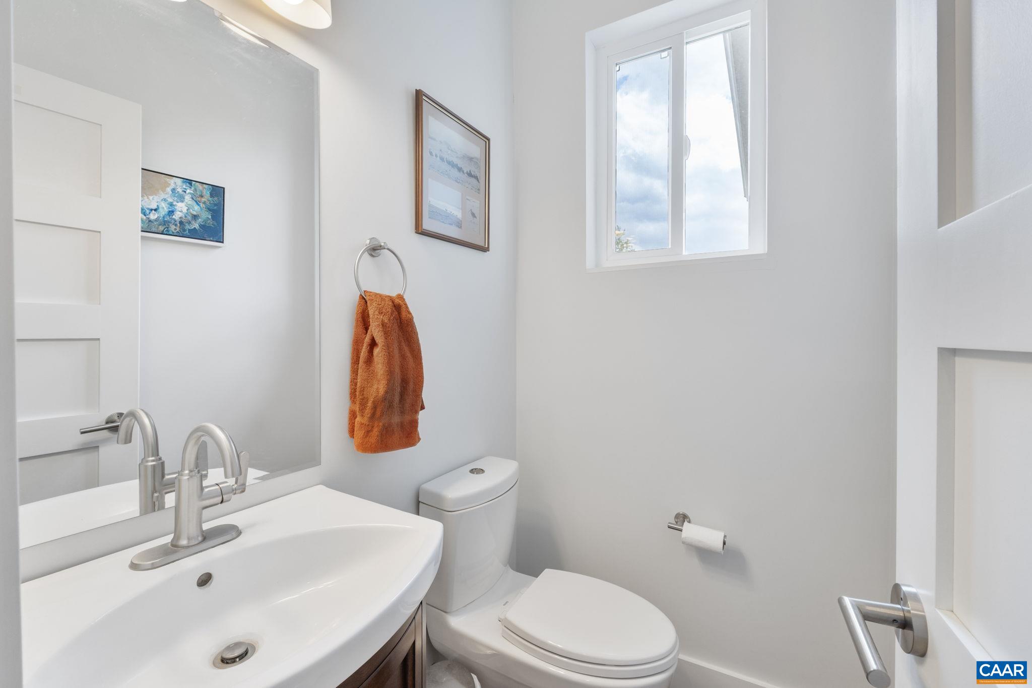 3457 Morgantown Road Charlottesville, VA 22903 - Photo 35 of 64 a bathroom with a toilet sink and mirror
