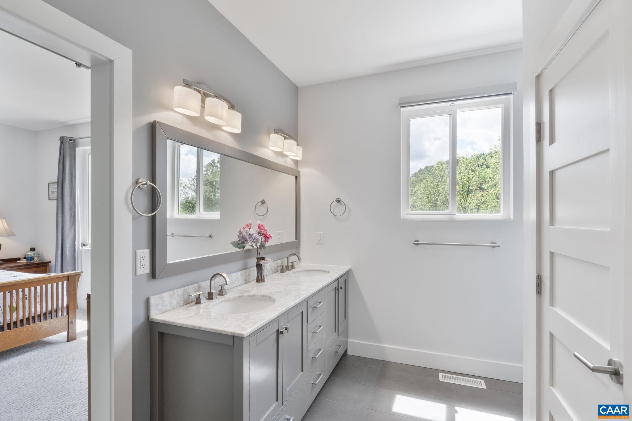 3457 Morgantown Road Charlottesville, VA 22903 - Photo 38 of 64 a bathroom with a sink and a mirror