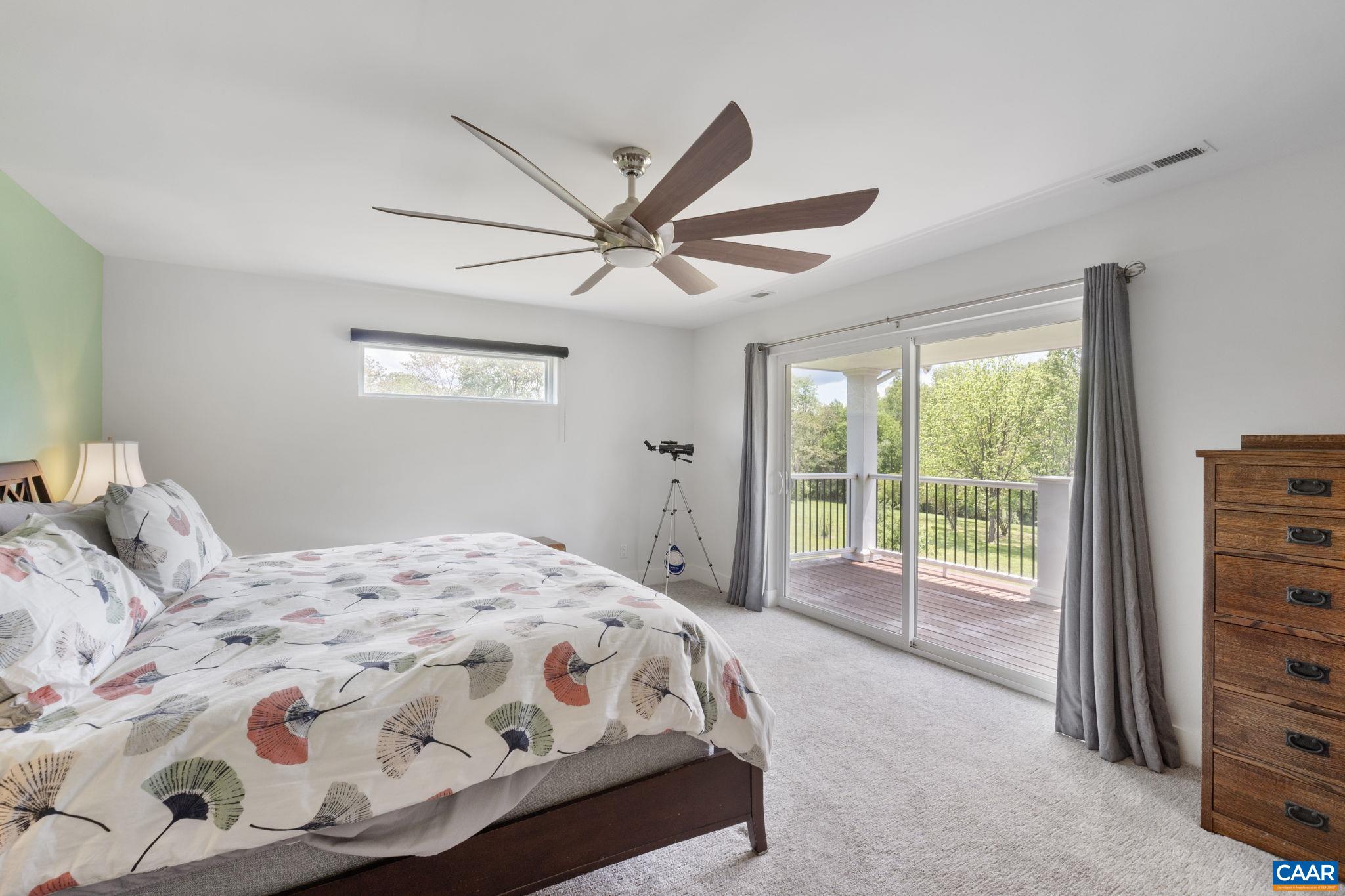 3457 Morgantown Road Charlottesville, VA 22903 - Photo 43 of 64 a bedroom with a large bed and a window