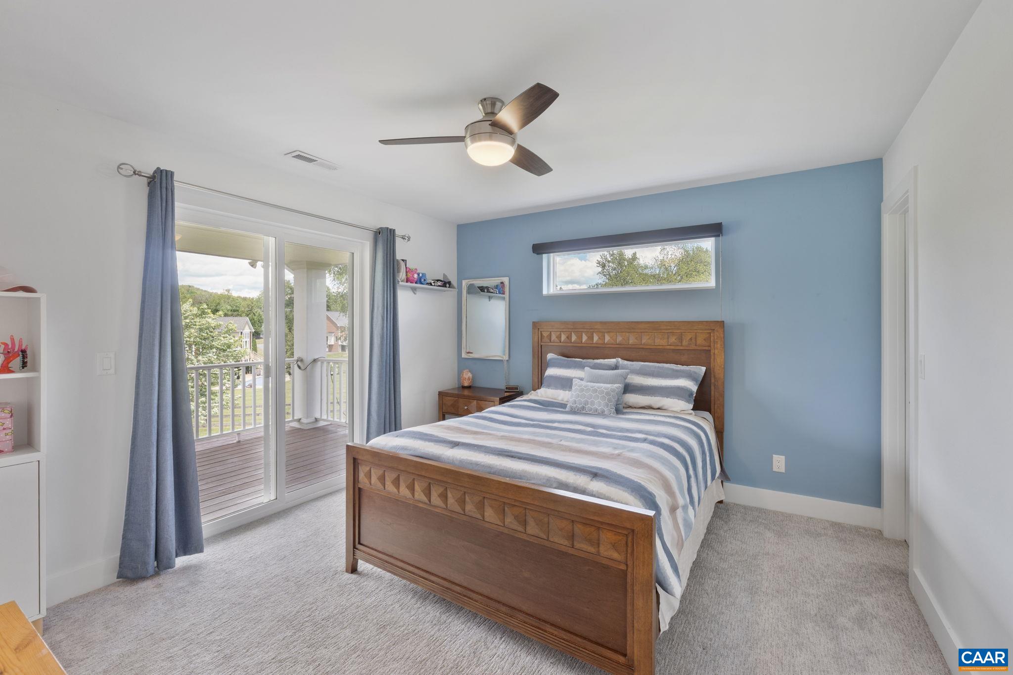 3457 Morgantown Road Charlottesville, VA 22903 - Photo 50 of 64 a bedroom with a bed and a large mirror next to a window