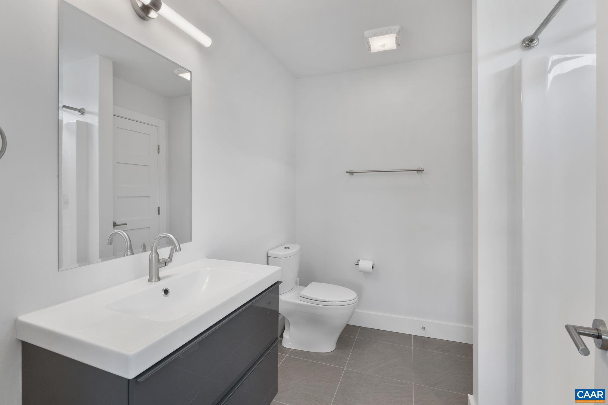 3457 Morgantown Road Charlottesville, VA 22903 - Photo 53 of 64 a bathroom with a sink toilet and vanity