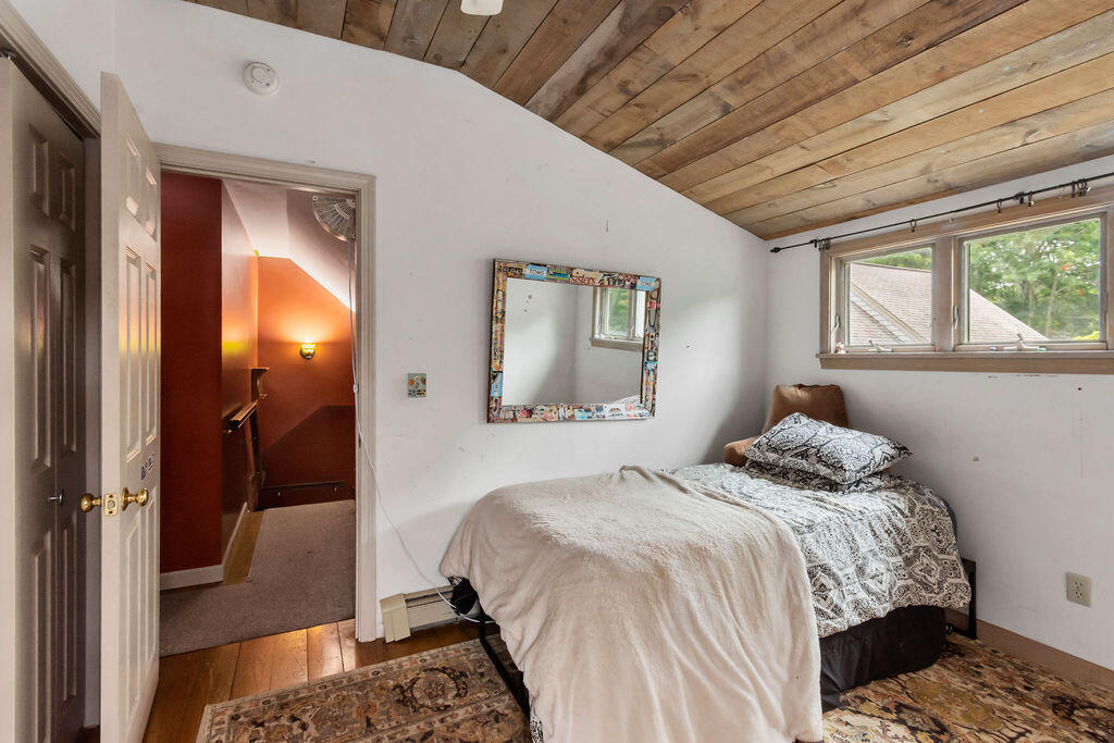 24 Indigo Lane Osterville, MA 02655 - Photo 54 of 84 a bedroom with a bed and a painting on the wall