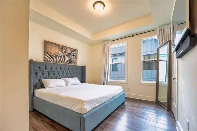 a bedroom with a large bed and a window