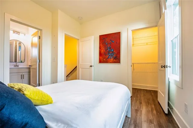 a bedroom with a bed and a view of bathroom