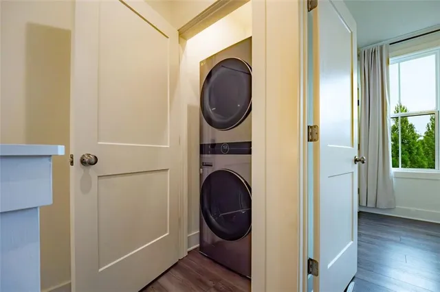 a view of a hallway with washer and dryer