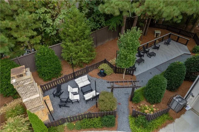 an aerial view of a house with garden space and street view