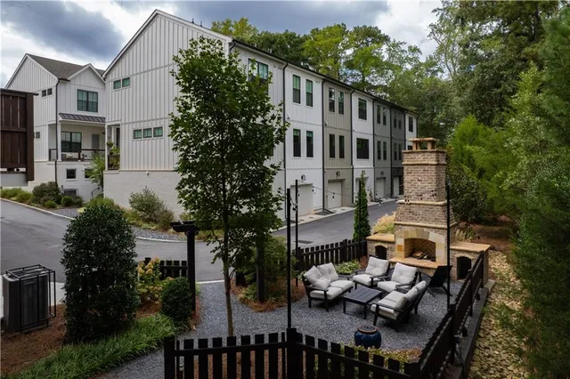 a view of house with patio outdoor seating and city view