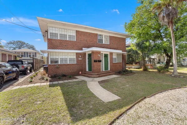 front view of a house with a yard