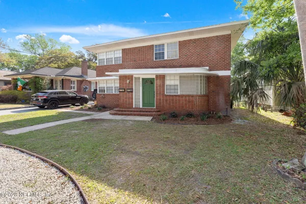 a view of a house with a yard