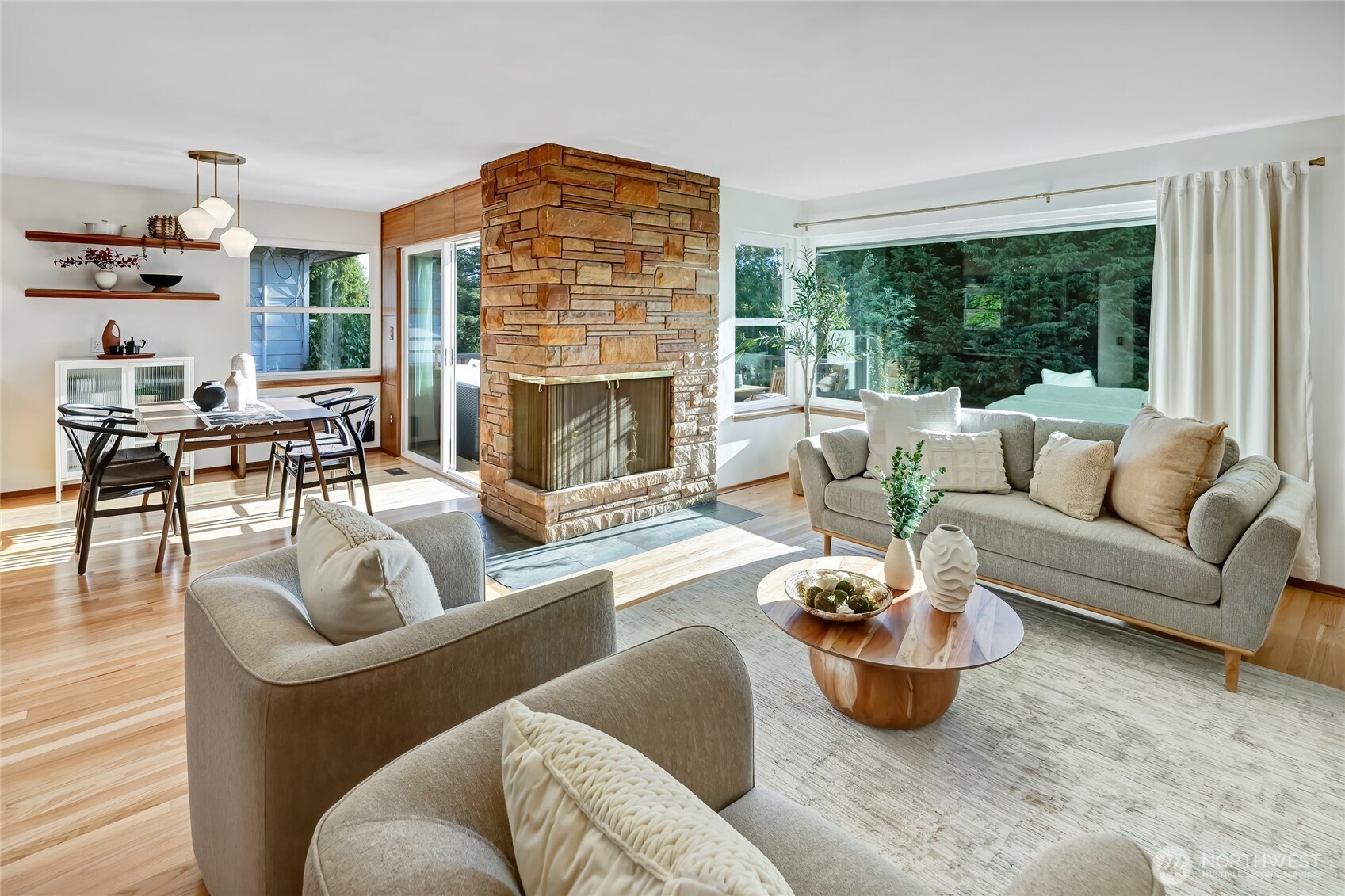 7571 45th Avenue Southwest Seattle, WA 98136 - Photo 4 of 40 a living room with furniture and a fireplace