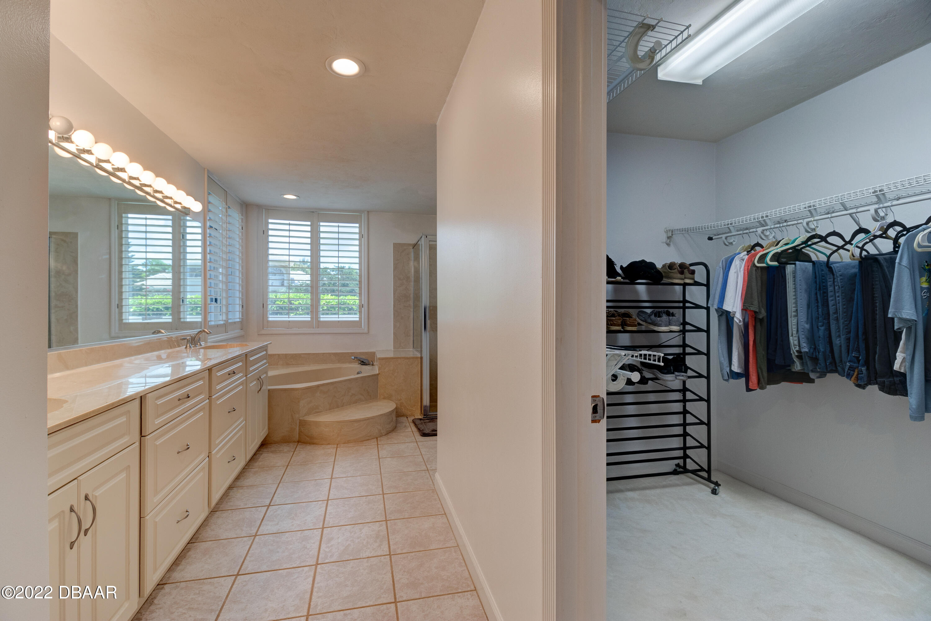 13 Bay Pointe Drive Ormond Beach, FL 32174 - Photo 15 of 44 a large white kitchen with a large window