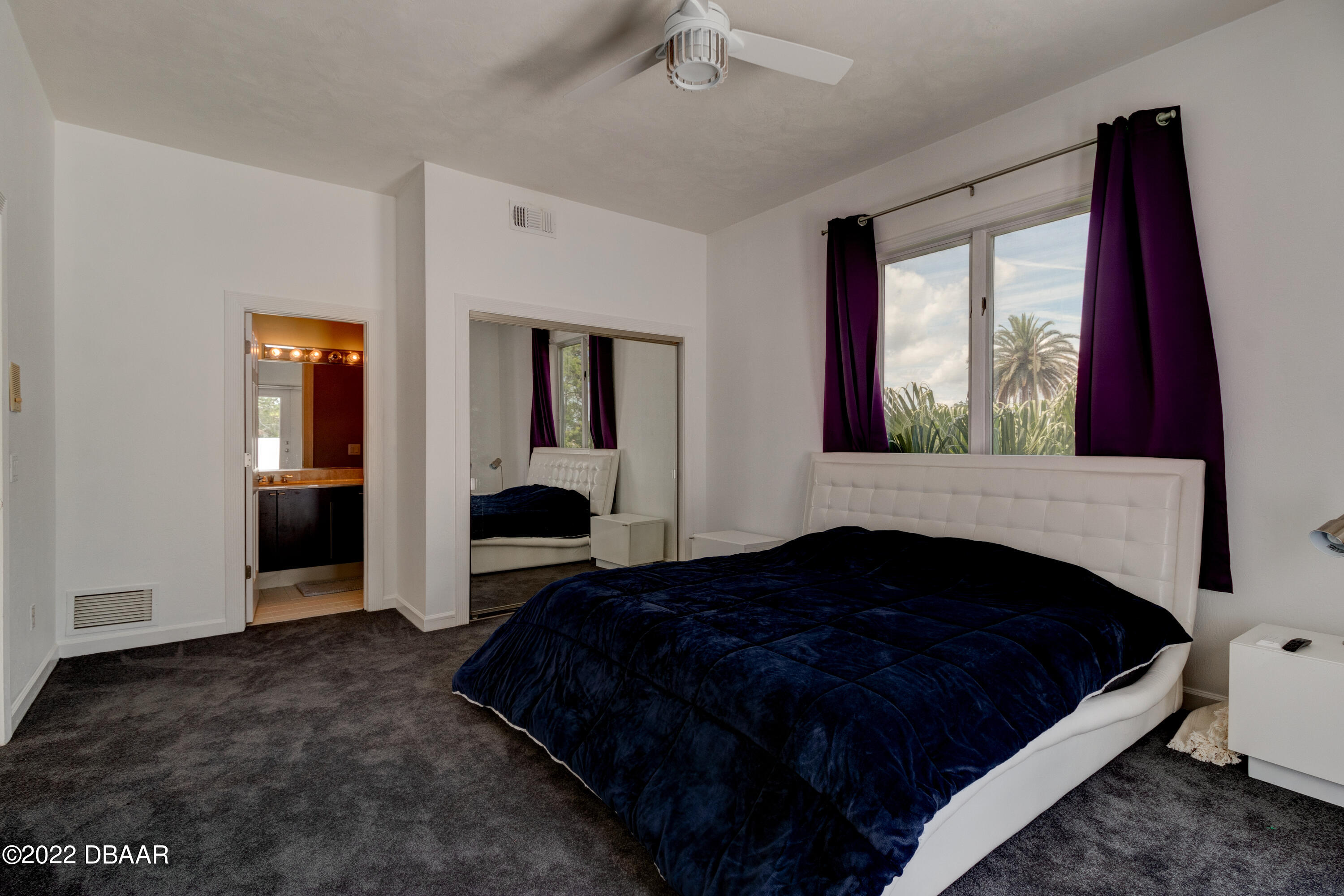 13 Bay Pointe Drive Ormond Beach, FL 32174 - Photo 22 of 44 a bedroom with a bed and a large window