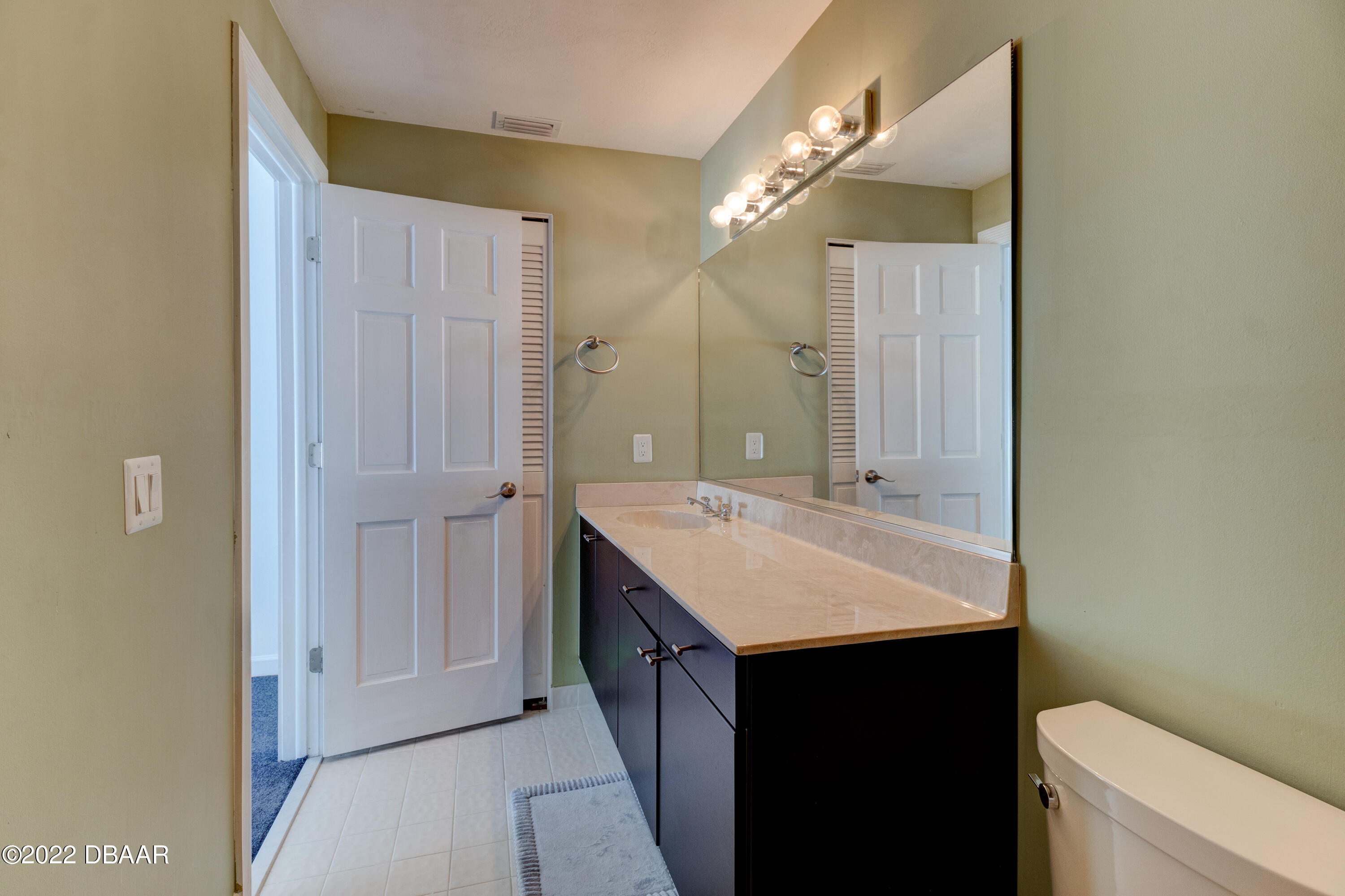 13 Bay Pointe Drive Ormond Beach, FL 32174 - Photo 23 of 44 a bathroom with a sink a toilet and shower