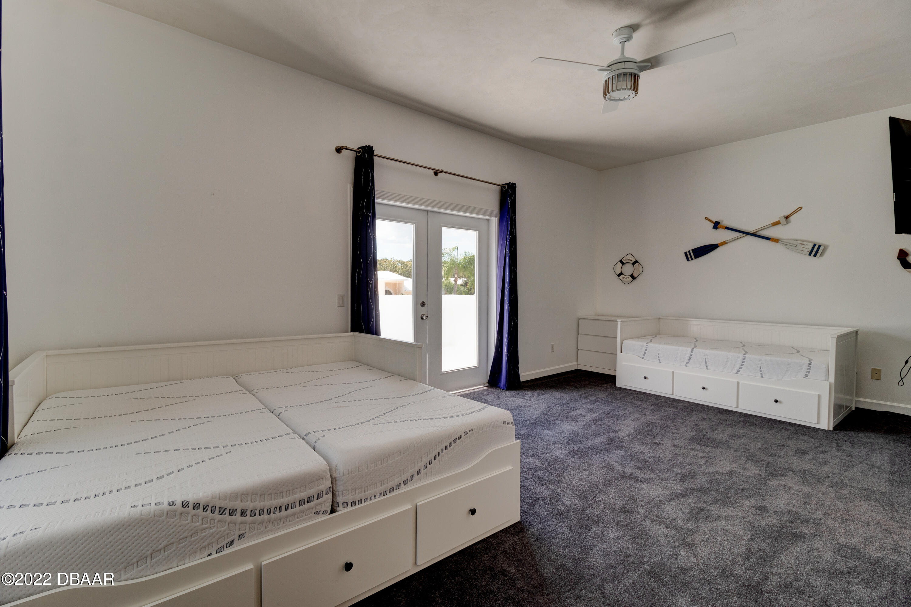 13 Bay Pointe Drive Ormond Beach, FL 32174 - Photo 24 of 44 a spacious bedroom with a bed and a window