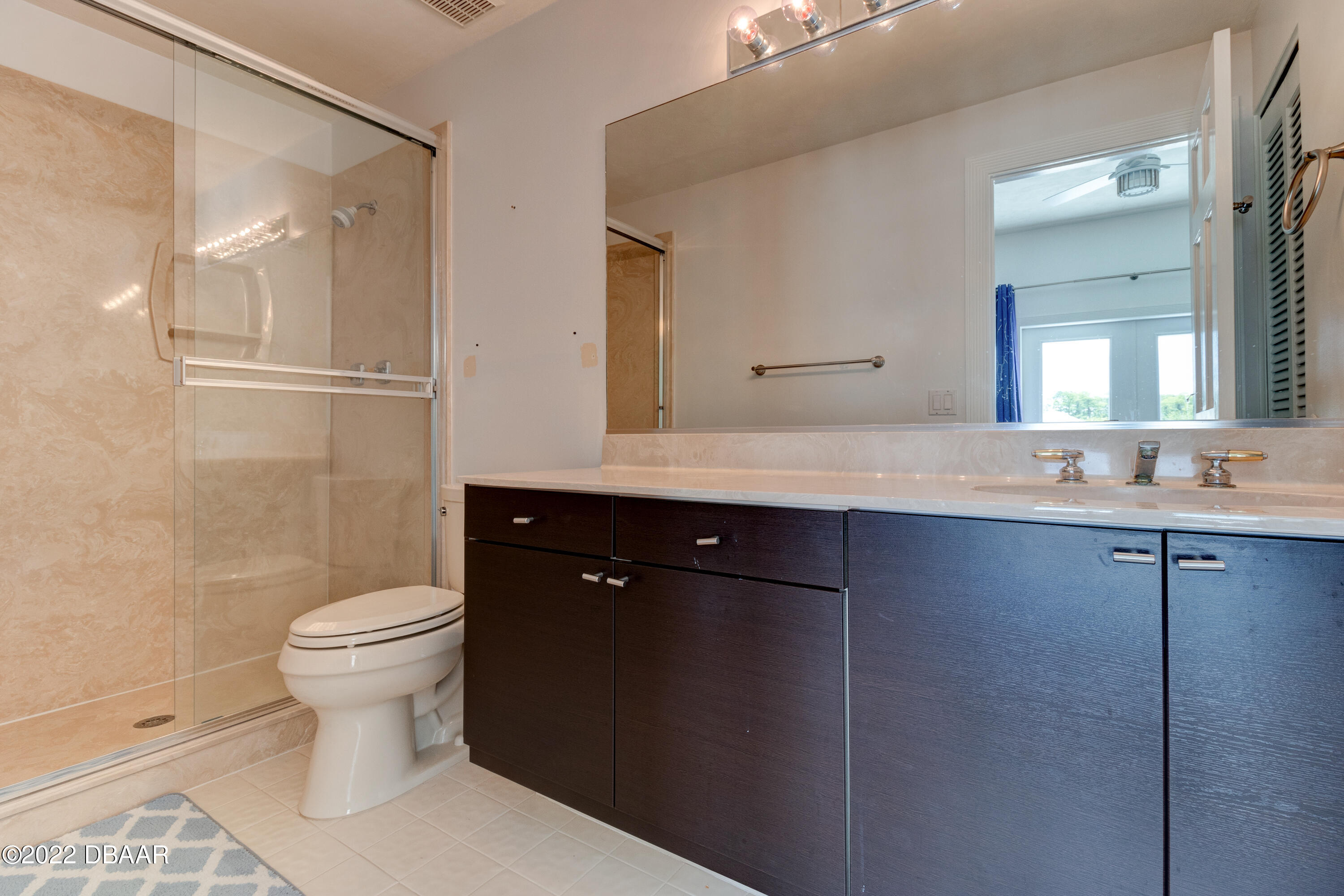 13 Bay Pointe Drive Ormond Beach, FL 32174 - Photo 26 of 44 a bathroom with a sink toilet and shower